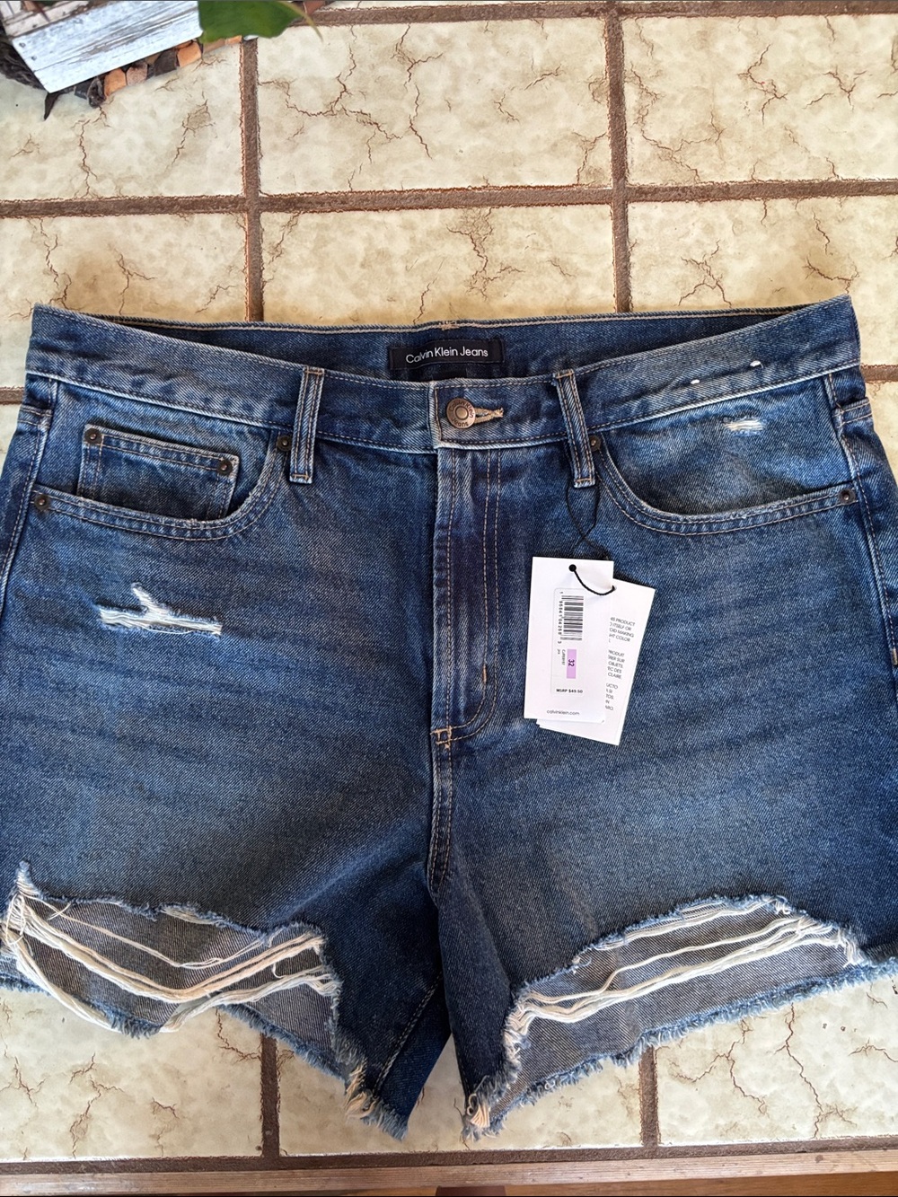 Calvin Klein Jeans distressed dark blue denim cutoff shorts